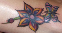 Lady Bug Flower Tattoo